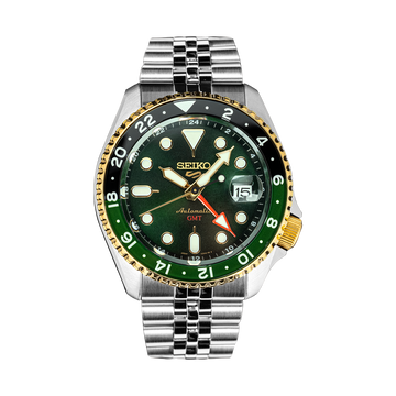 Close-up of the Forest Green Sunrise dial, lumibrite hands, golden GMT bezel, and date window with cyclops lens