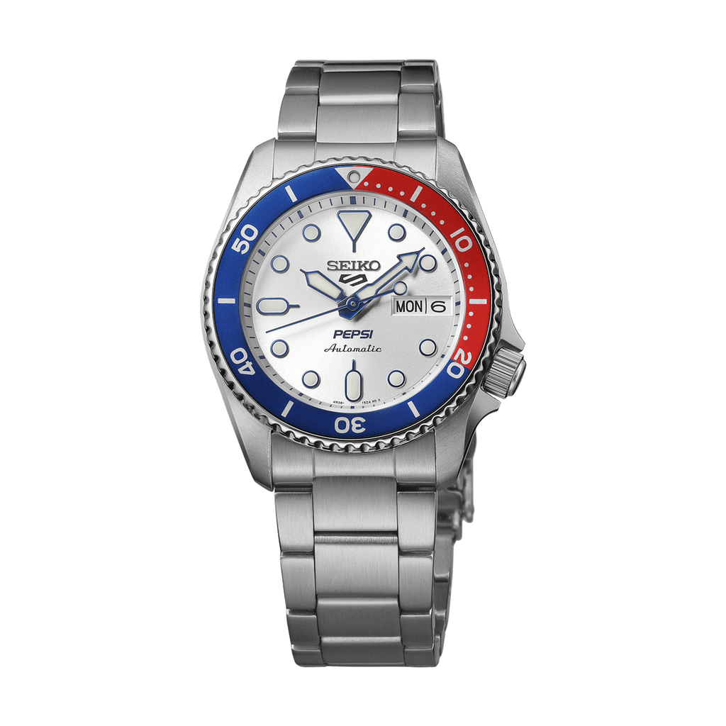 Close-up view of the Seiko 5 Sports x Pepsi® Limited Edition watch, highlighting the vibrant blue and red bezel against a stylish wrist.