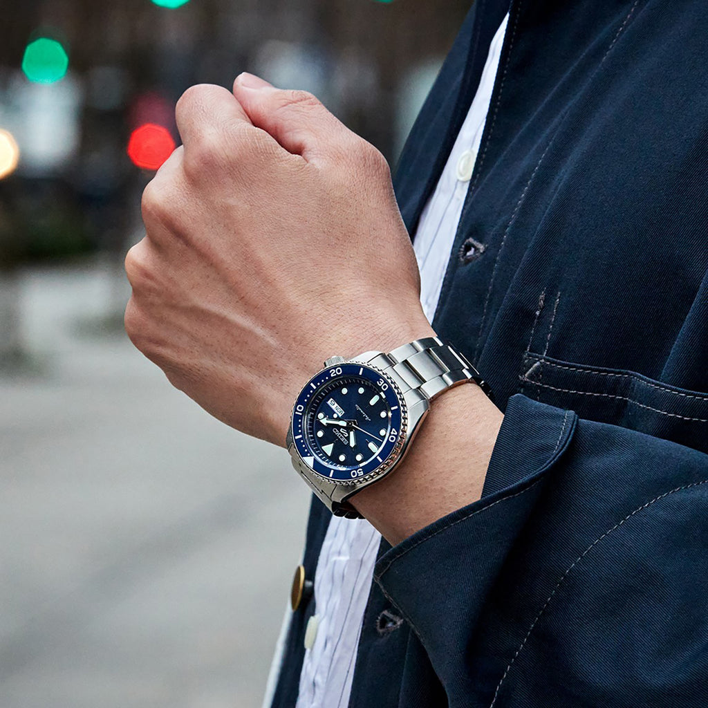 A Man Wearing Seiko 5 Sports Watch SRPD51K1