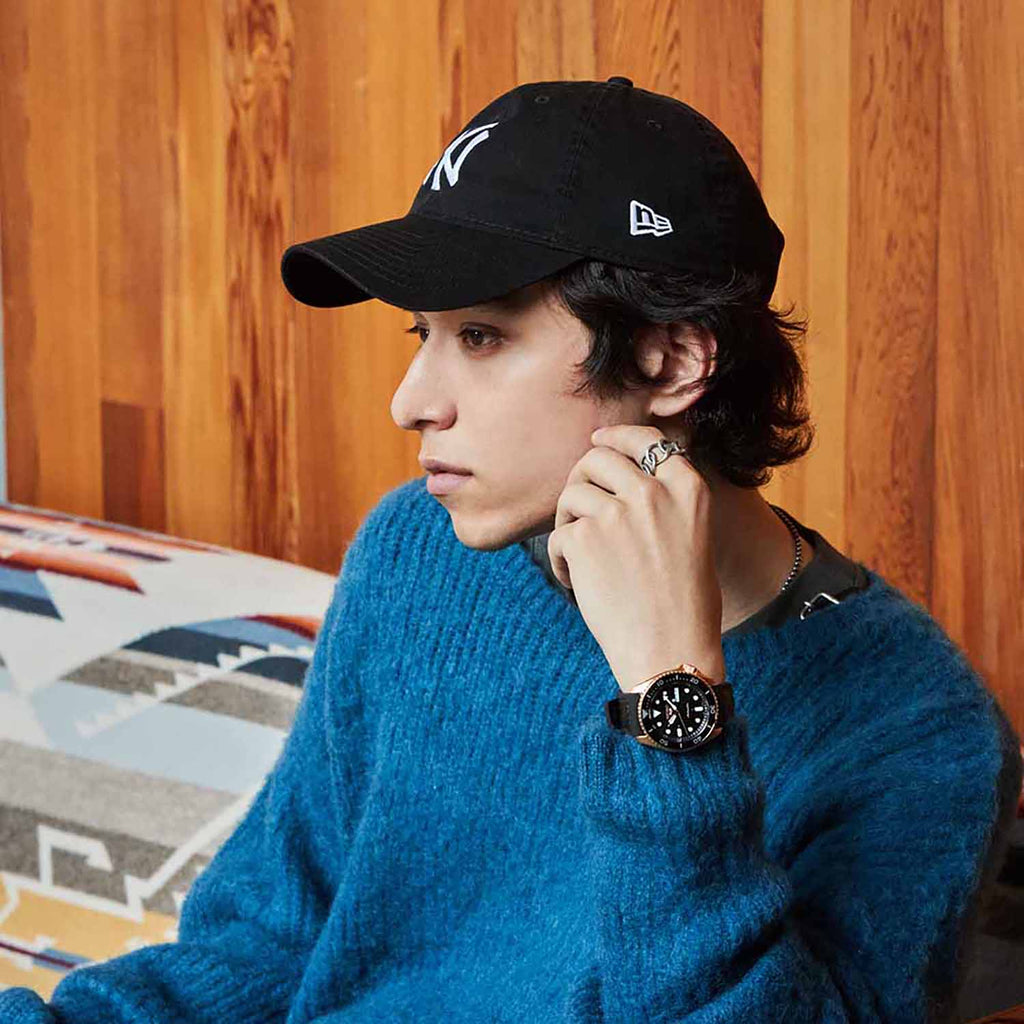 A Man Showcasing His Seiko 5 Sports Automatic Watch SRPD76K1