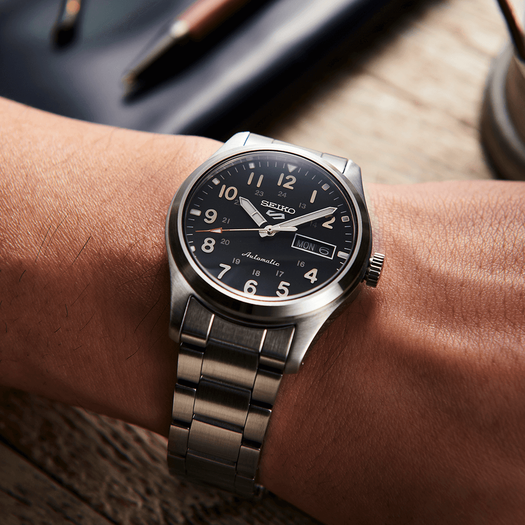 A Man Wearing Seiko 5 Sports Field Collection Watch SRPG27K1